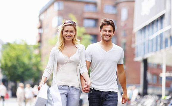 happy couple with shopping bags